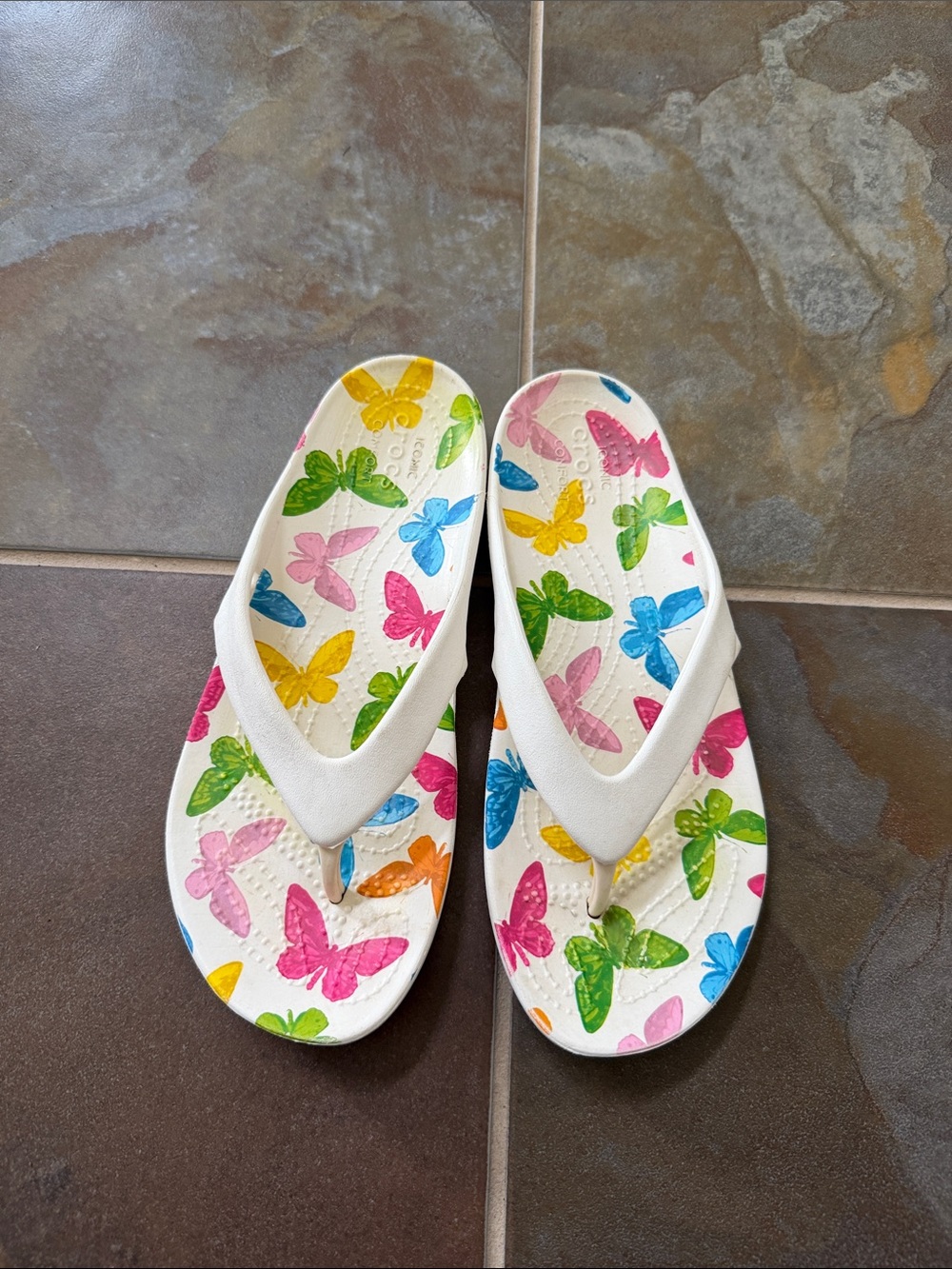 Crocs Kids White Flip Flops with Multicolor Butterfly Print